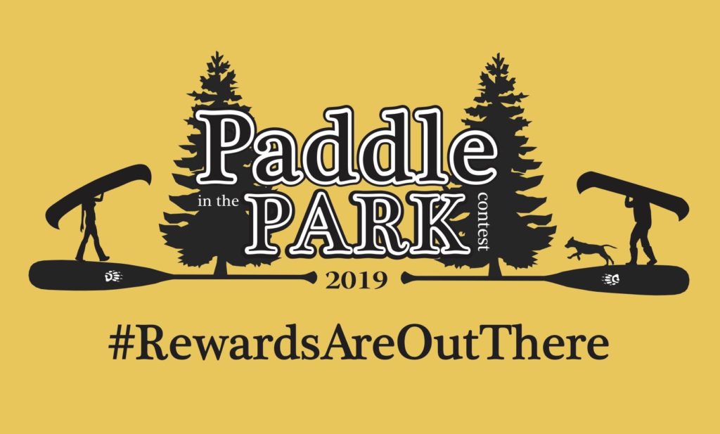 Paddle In The Park Contest Decal showing a man portaging a canoe with a dog and a woman portaging a canoe with trees and a logo