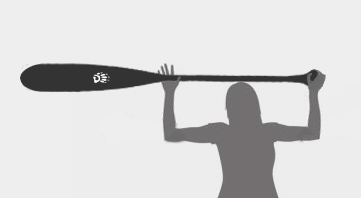 a woman holding a canoe paddle above her head to demonstrate correct sizing
