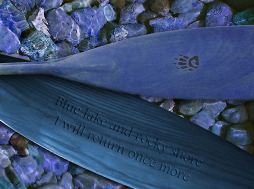 Ash canoe paddle tinted blue with the words, blue lake and rocky shore; I will return once more