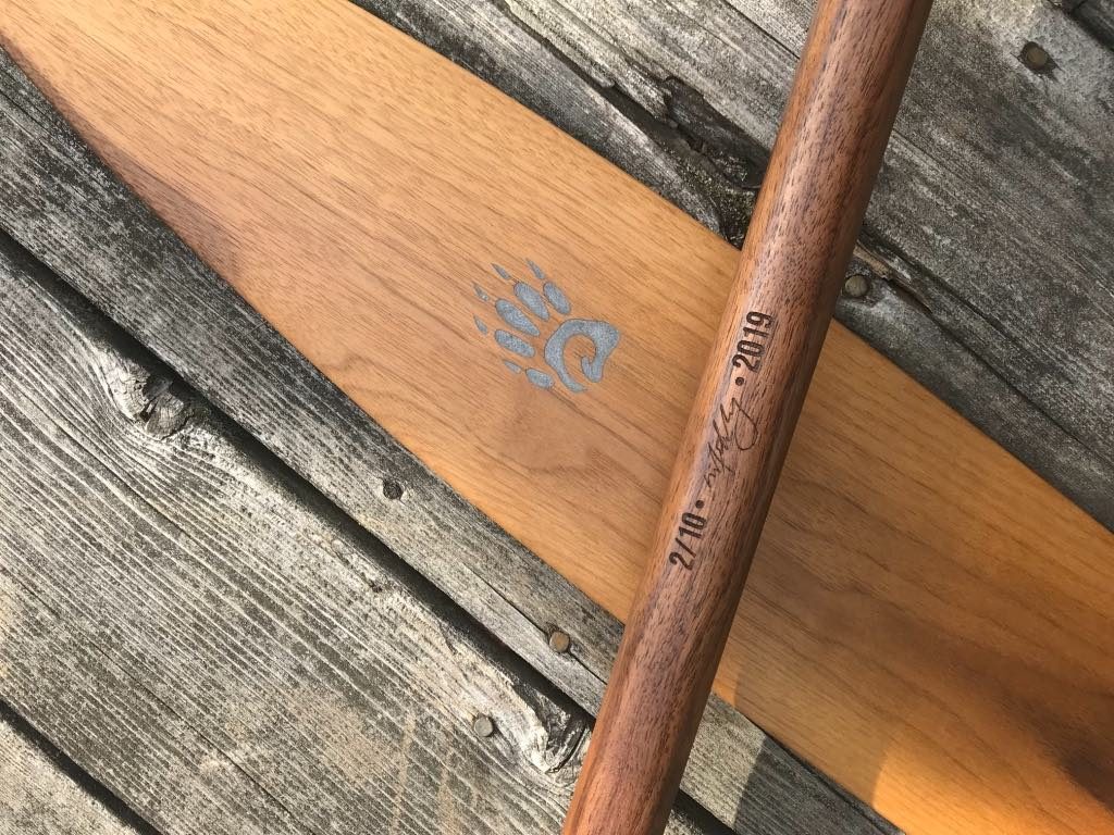 Special Edition Badger Walnut Canoe Paddles with aluminum inlay, laser engraved limited issue numbered, signed and dated on shaft, on barnyard background