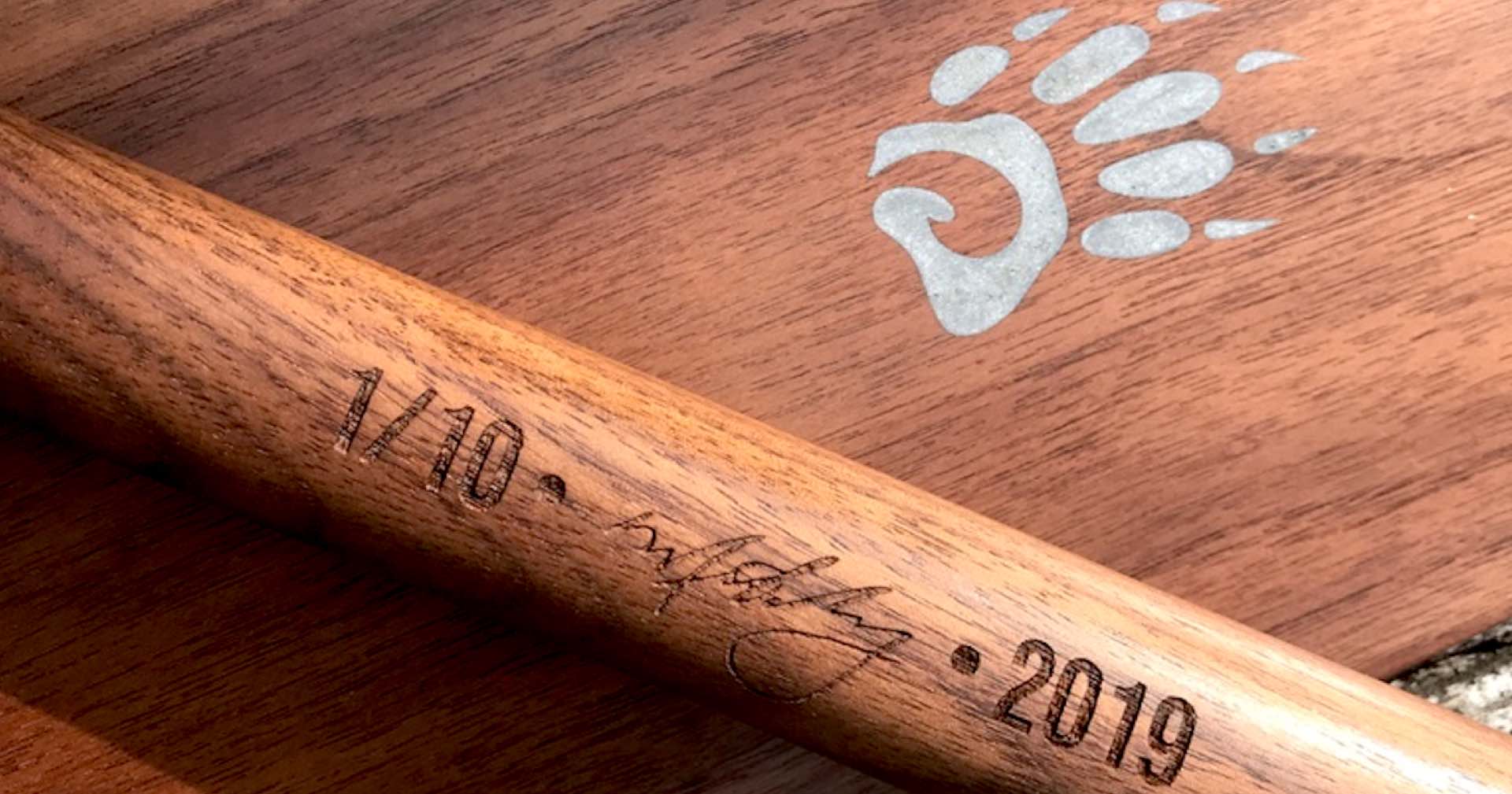 zoomed in image of aluminum epoxy inlay on a limited edition Badger Paddle with numbered signed and dated shaft of second special edition paddle limited issue