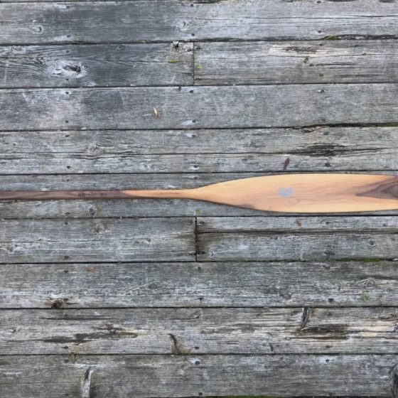 Special Edition Walnut Sliver Canoe Paddle on barn board background