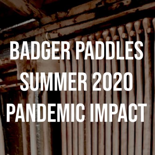 Badger Paddles 2020 Pandemic Impact textover racks of canoe paddles in the midst of production