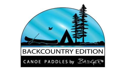 Backcountry Edition Canoe Paddles by Badger logo: Depicts the silhouette of a camping scene complete with a canoe, tent, trees, and flying hawk against a wispy blue sky.