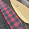 Showing detail on the blade of hand painted Buffalo Plaid Canoe Paddles