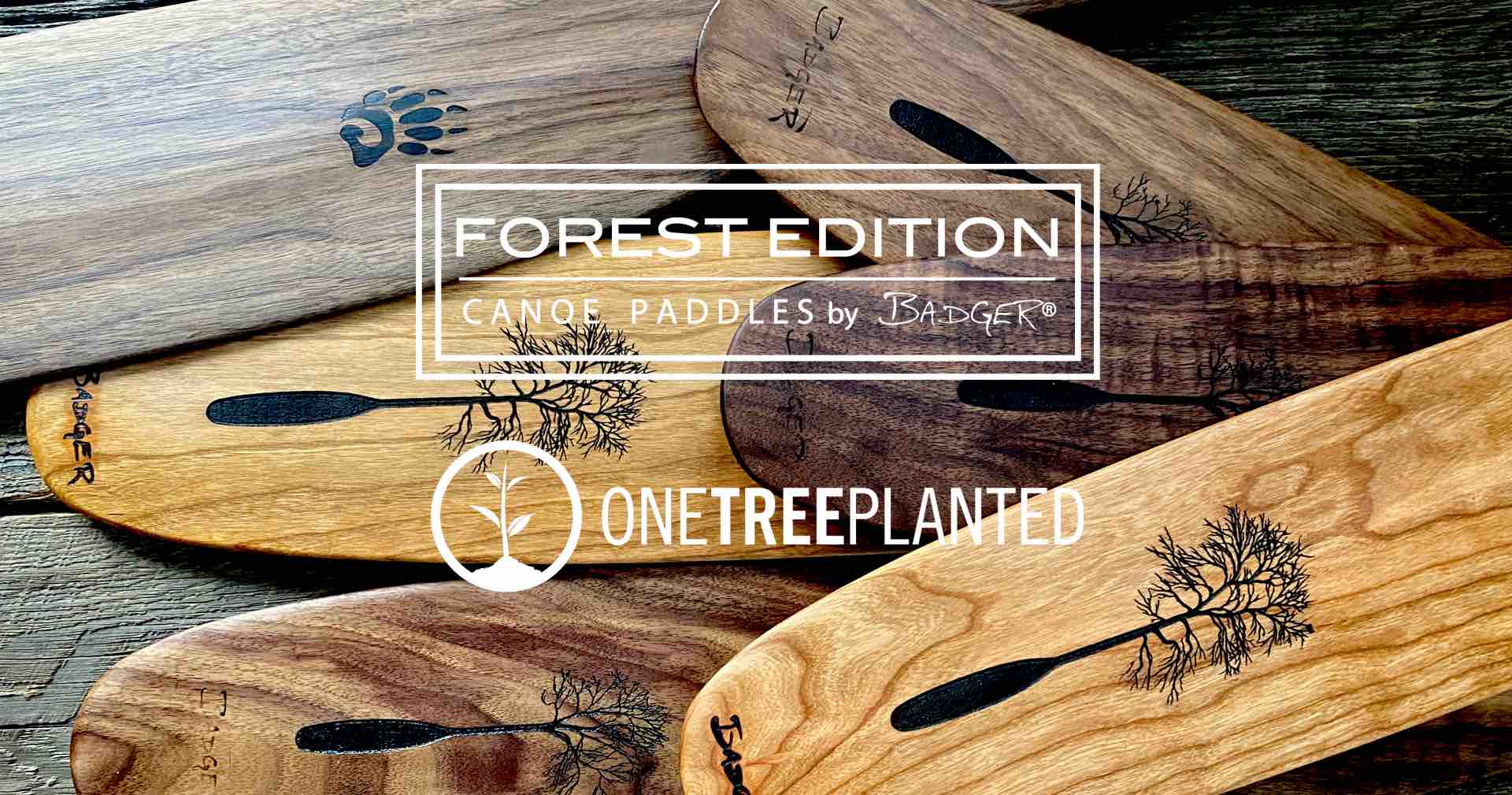 Collection of various cherry and walnut Forest Edition Canoe Paddles by Badger® featuring One Tree Planted