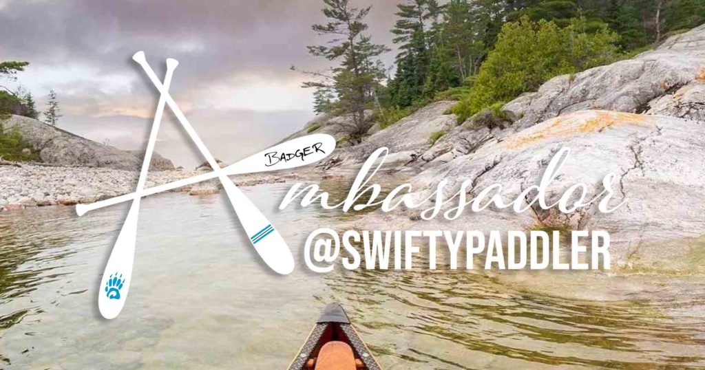 Stylized text that reads "Badger Ambassador @swiftypaddler over a wilderness waterway background