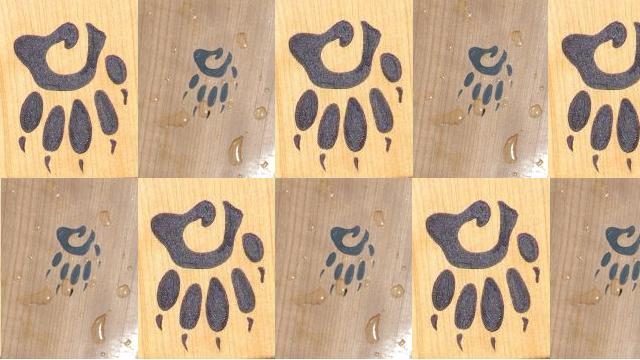 Small and big upside down Badger paw logos in a pattern using an image grid.