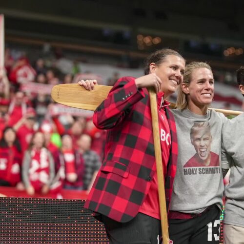 Retiring Olympic soccer champions Sophie Schmidt, Erin McLeod and Christine Sinclair posing proudly with their Badger canoe paddles during part of the home match festivities at Vancouver’s BC Place on 5 December 2023