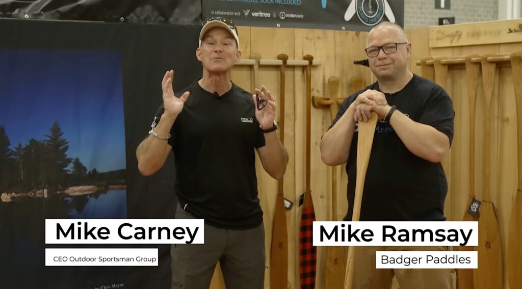 Mike Ramsay of Badger Paddles with Mike Carney of Outdoor Channel explaining how to choose the right canoe paddle at Canoecopia 2026